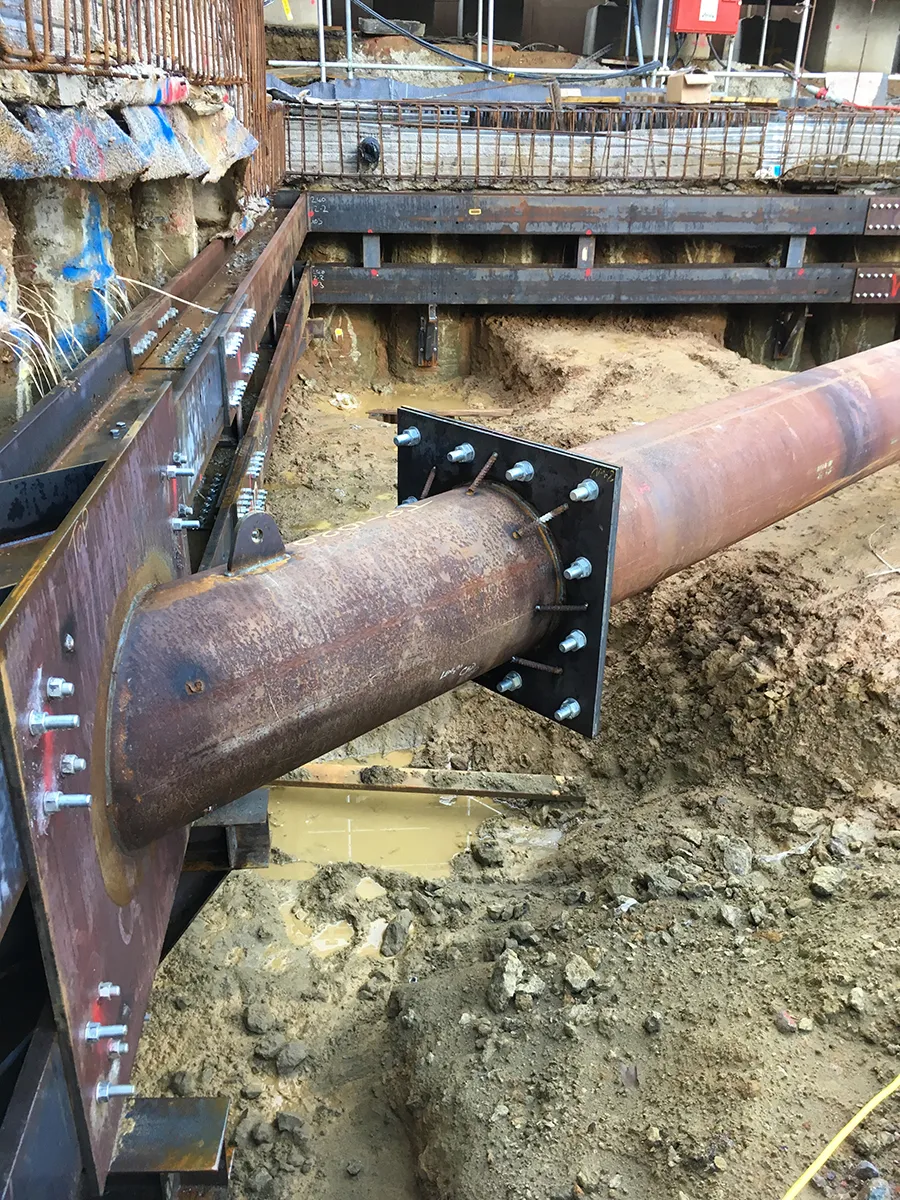 Temporary steel support beams on a construction site
